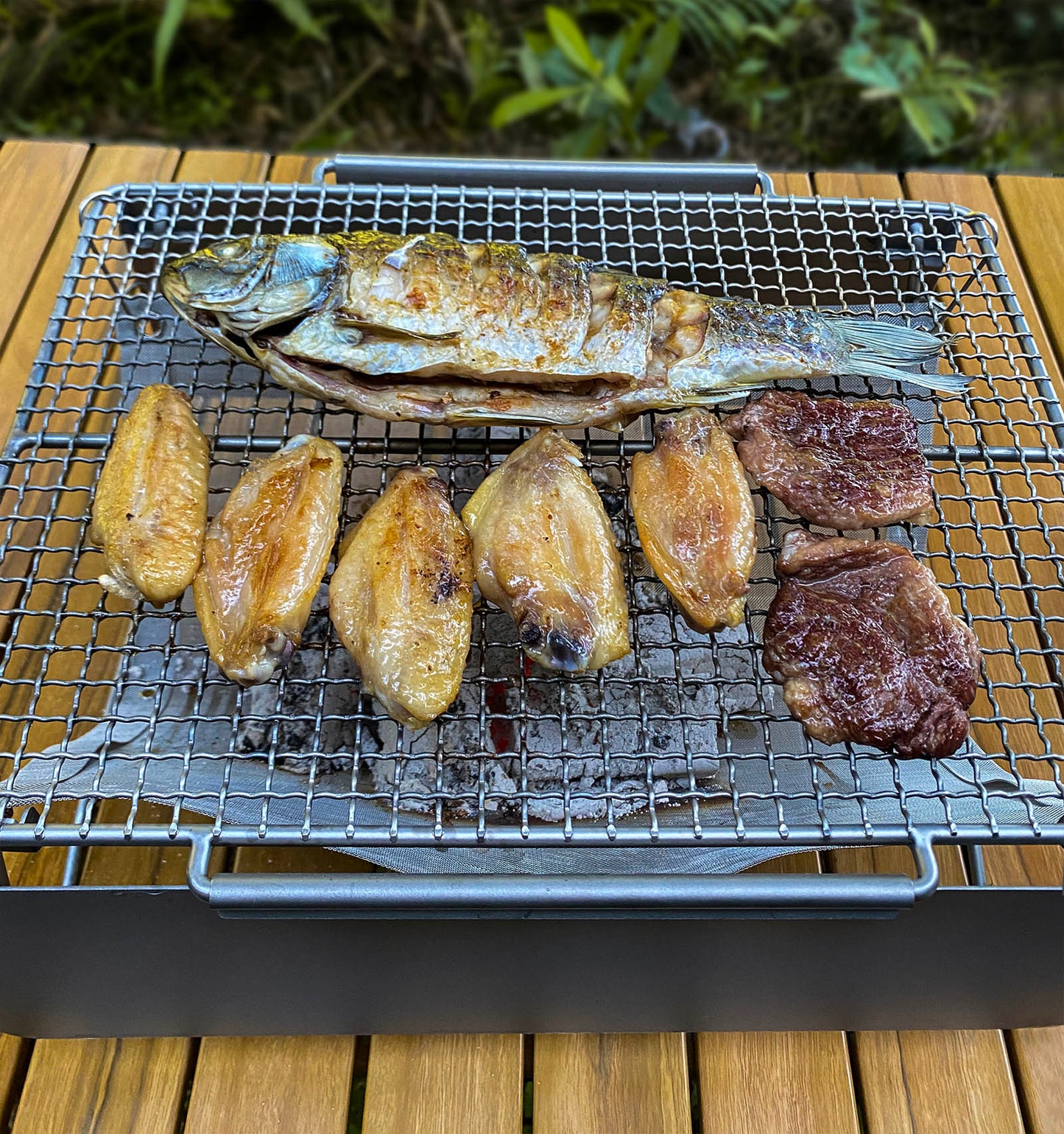 Boundless Voyage TA1 Titanium 2-in-1 Folding Campfire Grill – Portable Outdoor BBQ Table with Frying Plate & Collapsible Legs for Camping, Picnic & Backpacking